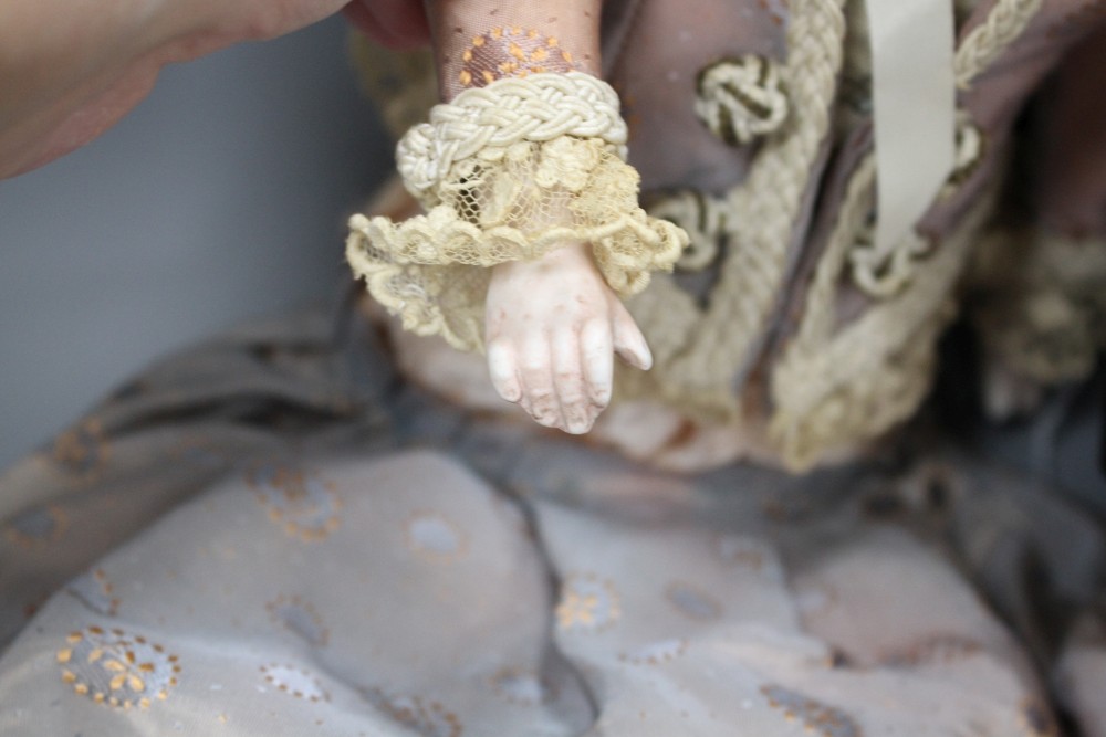 Two Armand Marseilles bisque head dolls, Floradora AOM, overall length 49cm and a child doll in Scots dress 390A2M, 44cm